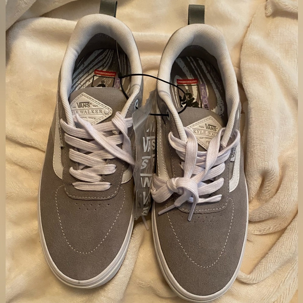 Gray brand new vans without box. Comes with gray laces. Size 7.5 men’s